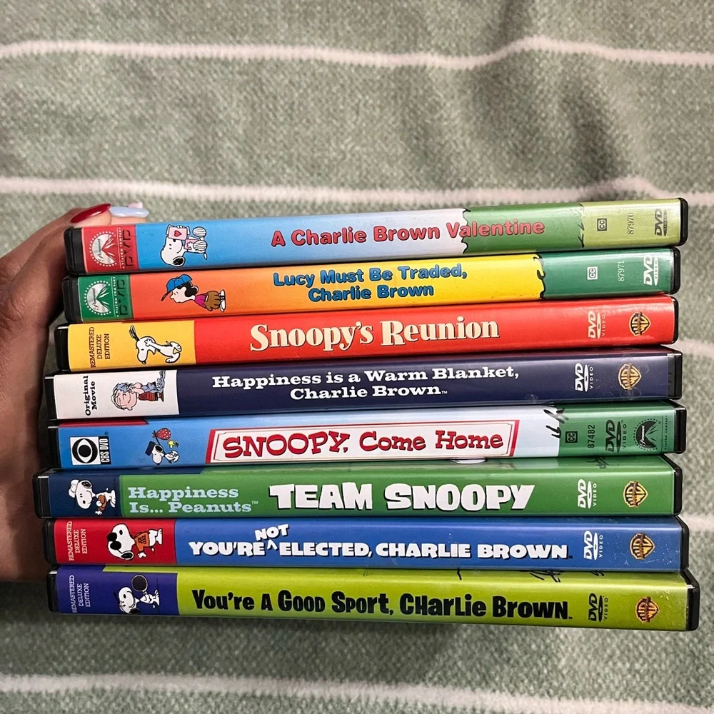 Peanuts VHS Set with Colorful Character Covers - Red, Yellow, Green, Blue, Black